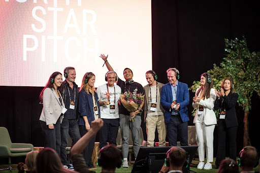Daniel Nilsson and Noel Braganza on stage together with the judges MuchSkills wins North Start pitch